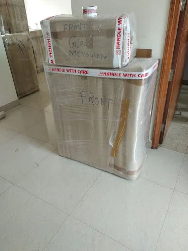 Packers and movers in Rudrapur loading household goods for long distance shifting to Delhi